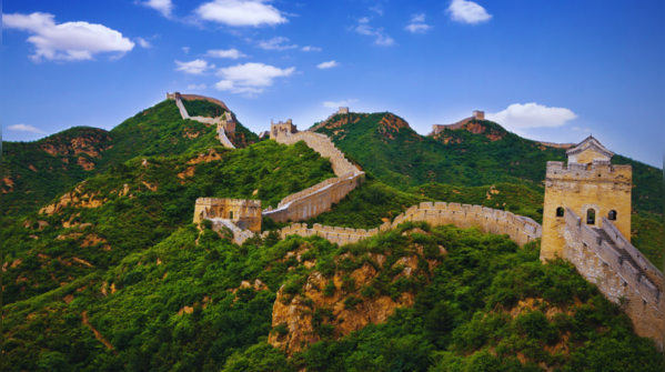 The snaking Great Wall of China stretching across mountain ranges.