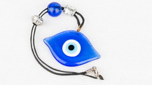 Broken Evil Eye bracelet, symbolizing absorbed negative energy.