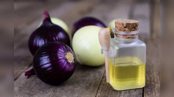 Applying onion juice to stimulate hair regrowth.