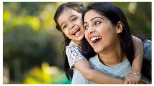 Parents modeling friendly behavior during a social interaction.