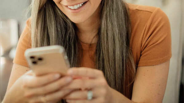 Person using both hands, scrolling with one thumb
