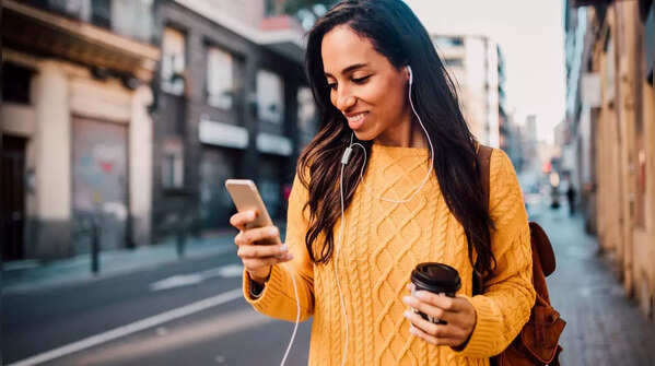 Person holding phone in one hand and scrolling with the same thumb