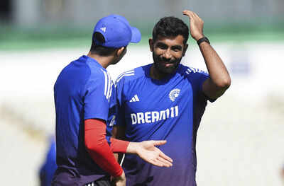 Shubman Gill and Jasprit Bumrah discuss strategy during a practice session.