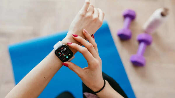Person using a fitness tracker to monitor their heart rate